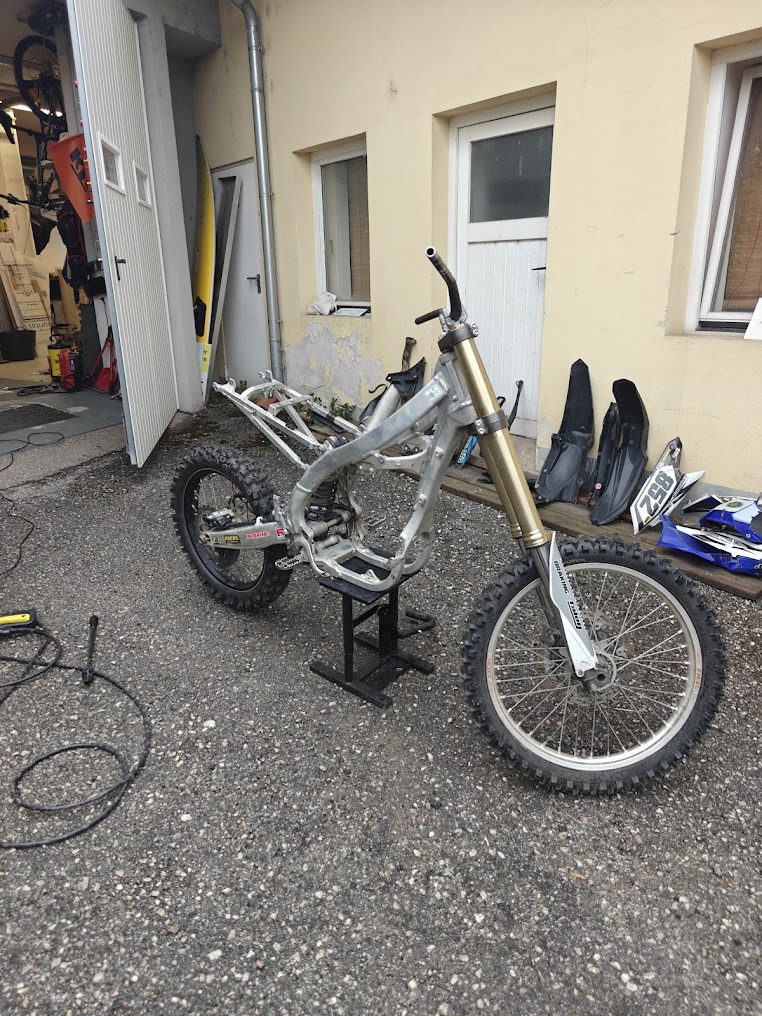 The motocross frame after the combustion engine was removed